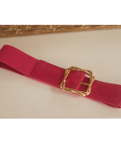 fushia belt with square gold buckle
