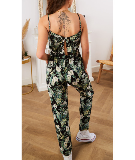 black jumpsuit with nature motif bare back