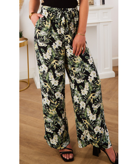 flowing black trousers with nature print and belt