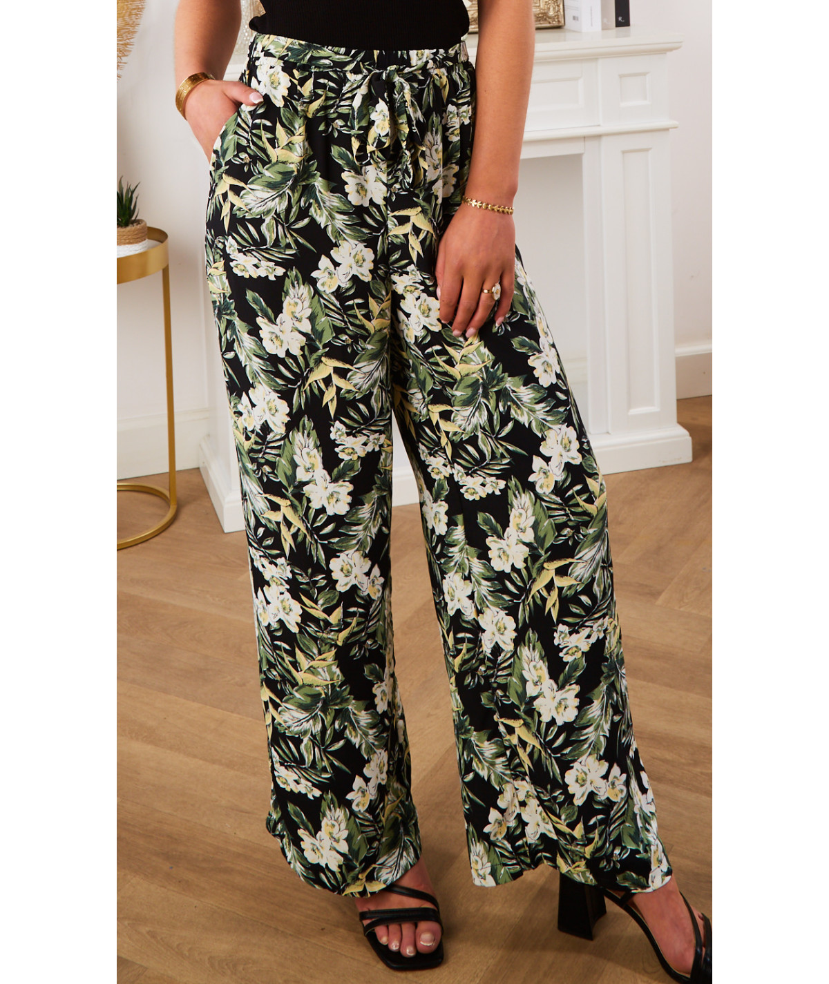 flowing black trousers with nature print and belt